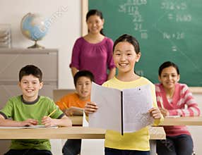Student reads her report in school classroom