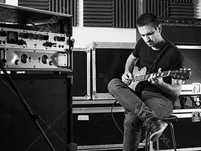Guitarist playing backstage