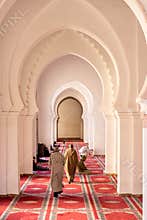 Praying Muslims inside a mosque