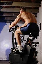 Male on exercise bike