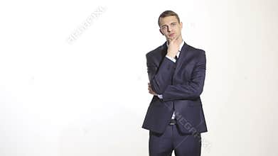 Body language. man in business suit isolated on white background. stroking the chin,