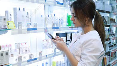 Pharmacist using a digital tablet