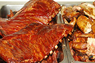 BBQ ribs and chicken in a buffet line