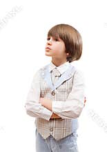 Small boy stands with crossed arms