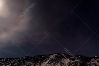 Mountains star moon halo sky
