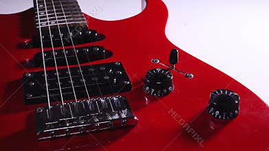 Red electric guitar. volume control. switches animation. rotation