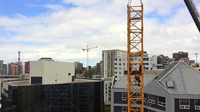 Time lapse of builders assemble a tower crane