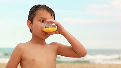 Boy drinking orange juice