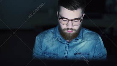 Handsome man using PC