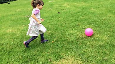 Happy girl play with a ball