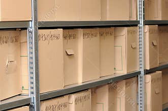 Cardboard Archive Boxes on Industrial Shelving in Document Storage Facility