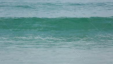 Azure waves rolled on the sand of Karon Beach