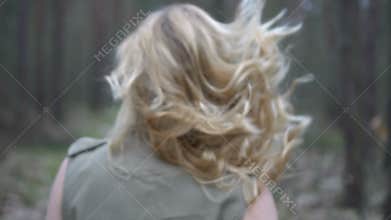 Blonde woman in the forest