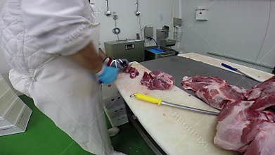 Skilled Butcher in Action With a Sharp Knife