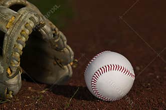 Baseball in glove on the field