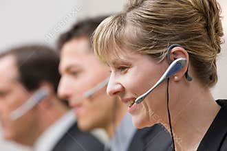 Co-workers in headsets working in call center