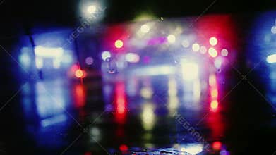 Rain drop with street colorful traffic lights at night blur bokeh abstract background vintage color tone, Cool chill