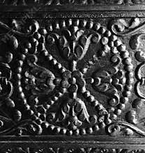 Intricate craftsmanship on antique wood door