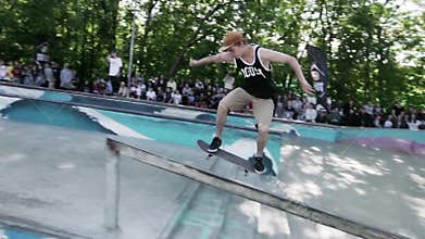 MOSCOW, RUSSIA - JUNE 6, 2015: Skater try make extreme back slid
