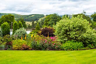 Beautiful walled, victorian garden with variety of flowers and trees