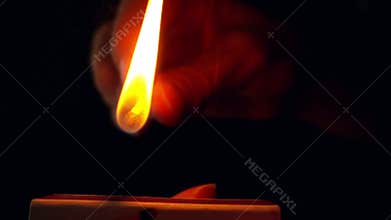 Lighting a match in slow motion