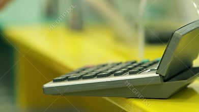 Close up on banker calculating finance