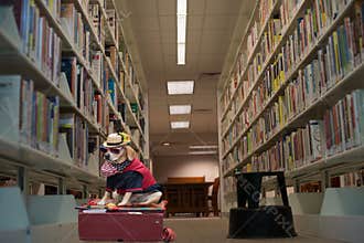 Funny dog pet in costume in the library