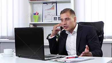 Businessman talking on the phone and nervous
