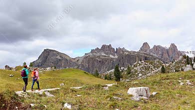 Girls hikers walking near of Cinque Torri towers