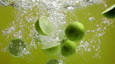Limes falling into water