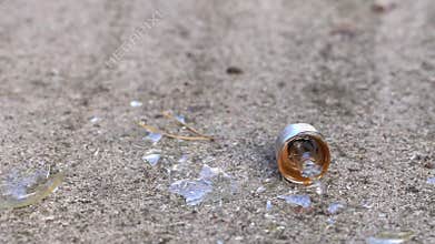 Light bulb crashing against concrete