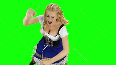 Girl in bavarian costume dancing isolated. Oktoberfest. Slow motion. Green screen