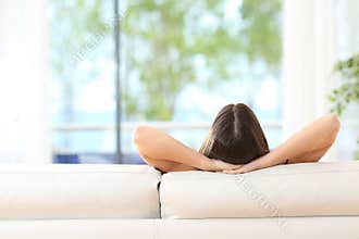 Woman relaxing on a couch at home