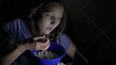 Girl watching movie in the cinema. 4K UHD