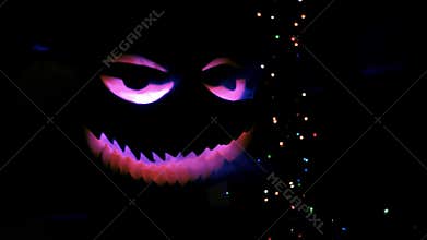On Halloween holiday Jack pumpkin shines in the darkness