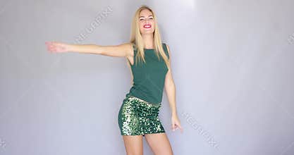 Happy and crazy beautiful young woman dancing