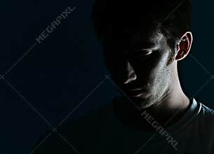 Man's Face in Shadow
