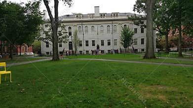Many people visiting the Harvard University Campus.