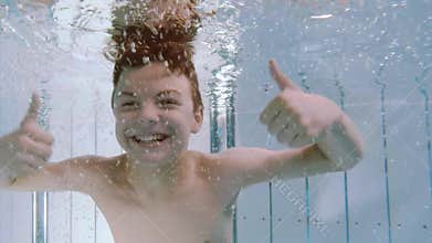 Underwater boy in aquapark
