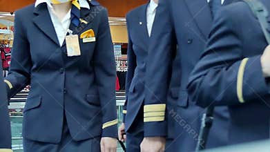 Pilots and flight attendants walking