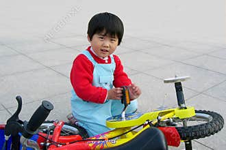 little girl and bicycle