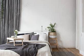 Interior of white and gray cozy bedroom