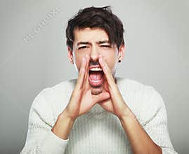 Handsome man yelling