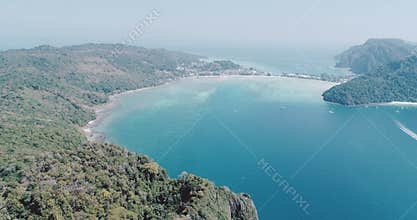 Aerial drone video of iconic tropical beach and resorts of Phi Phi island