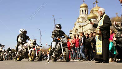 Priest blesses motorcyclists before the trip