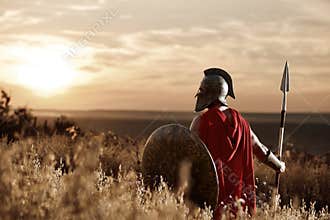 Warrior wearing iron helmet and red cloak.