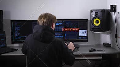The rooms are equipped with computers. Nervous man angry, beat his hands on the keyboard and the desk. On-screen