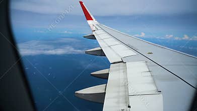 Airplane window view day, on the wing of an airplane. passenger aircraft aviation airline flying traveling busyness
