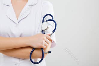 Hands holding stethoscopes
