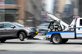 Tow truck delivers the damaged vehicle